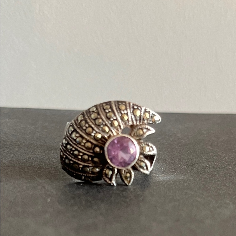 Vintage sterling silver amethyst ring surrounded by shimmering marcasite stones